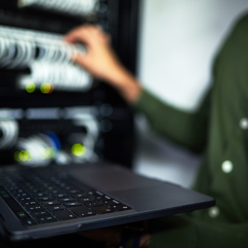server-room-maintenance-laptop-and-technician-at-2023-11-27-04-58-38-utc Server room maintenance, laptop and technician at work for cyber security and building network. Pro.